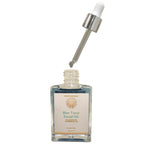 Blue Tansy Facial Oil with dropper on a white background