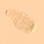 Cream Exfoliant on a peach background