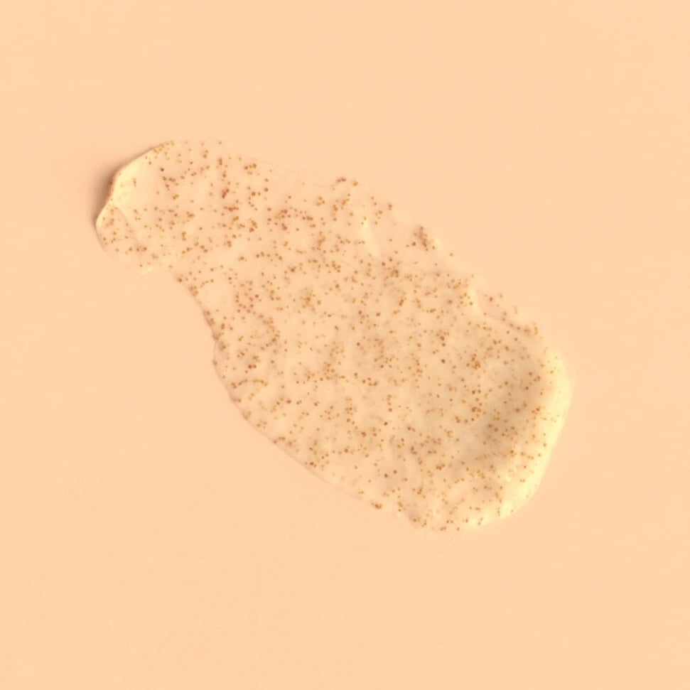 Cream Exfoliant on a peach background