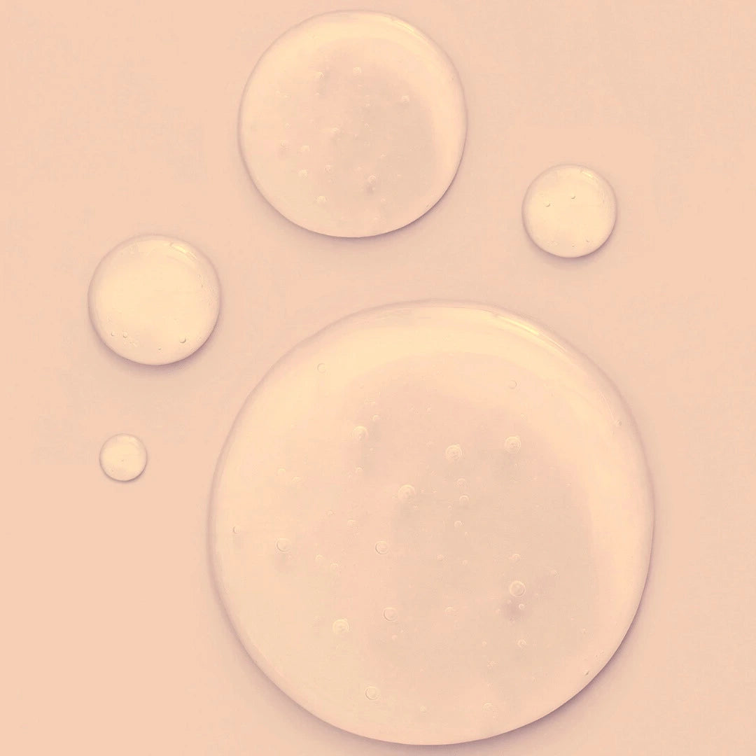 Hydrating Beauty Serum on a Pastel pink background with varying-sized circular shapes