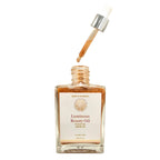 Bottle of Luminous Beauty Oil with dropper on a white background