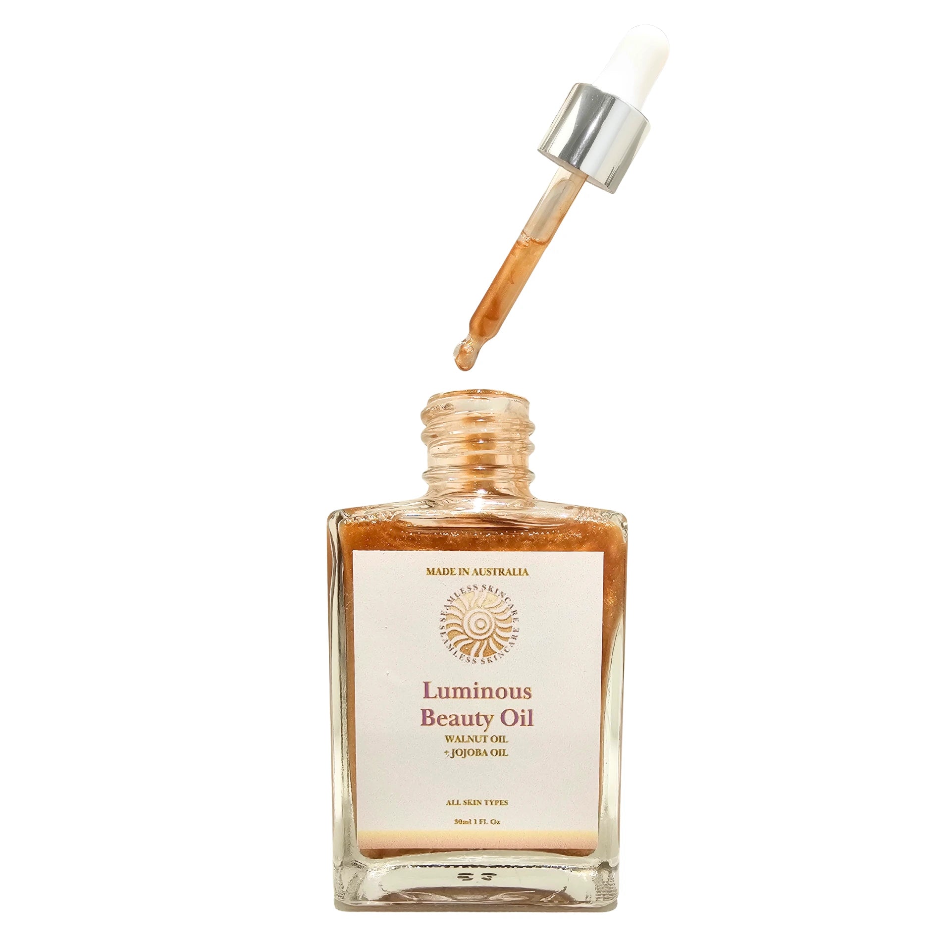 Bottle of Luminous Beauty Oil with dropper on a white background