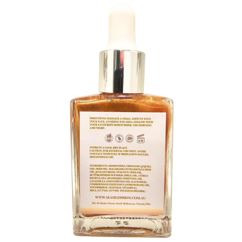Back of Luminous Beauty Oil bottle with dropper on a white background