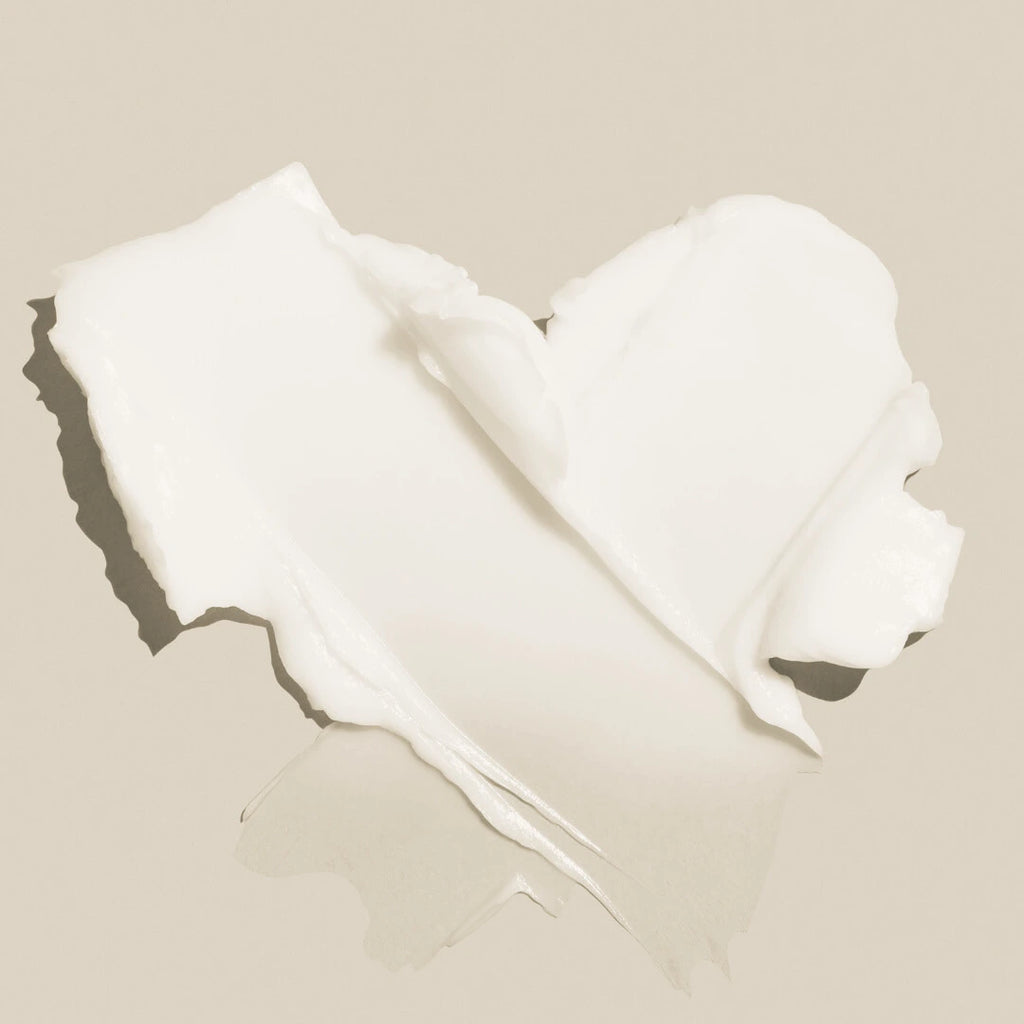 Swatch of Lush Cream Cleanser on a beige background