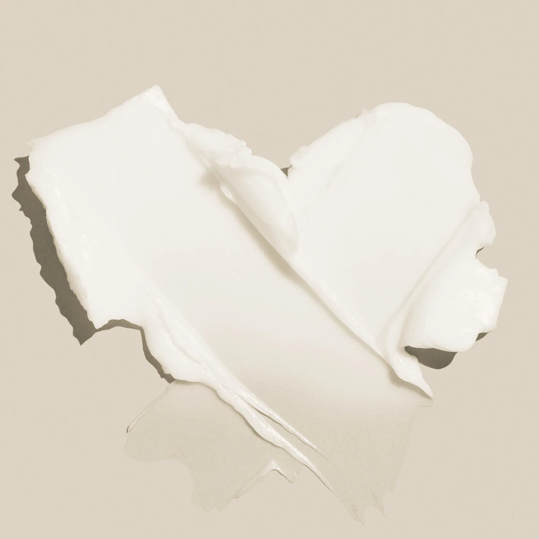 Swatch of Lush Cream Cleanser on a beige background