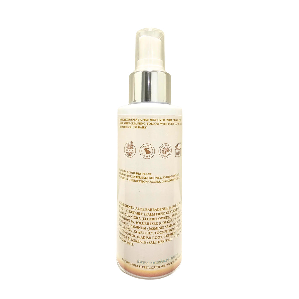 Back of Serenity Skin Mist bottle with silver cap on a white background