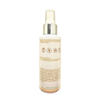 Back of Serenity Skin Mist bottle with silver cap on a white background